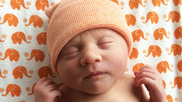 Newborn baby with Dignity Health blanket